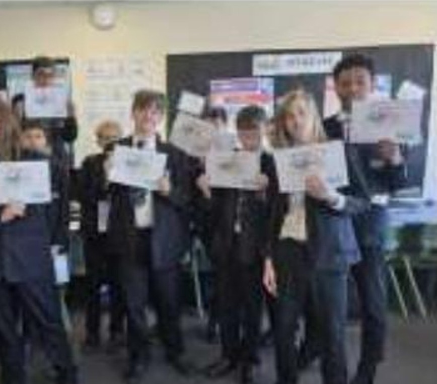 Pupils holding their TechKids AI workshop certificates